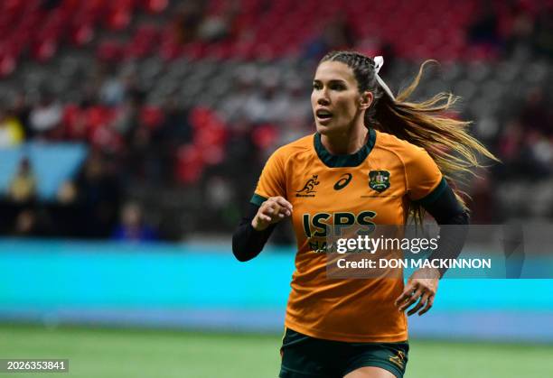 Australia's Charlotte Caslick in action during the 2024 HSBC Canada Sevens rugby tournament match between Australia and Fiji at BC Place Stadium in...