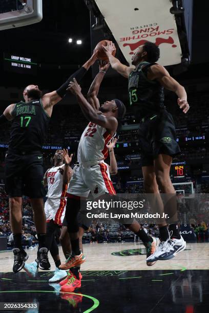 Players go up for the rebound during the game on February 23, 2024 at the Smoothie King Center in New Orleans, Louisiana. NOTE TO USER: User...