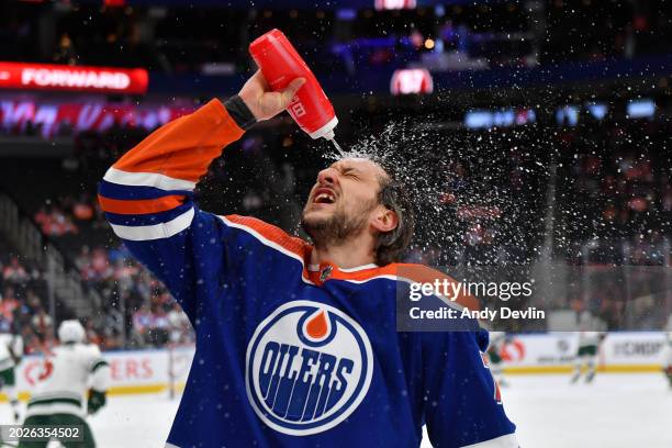 Vincent Desharnais of the Edmonton Oilers cools off with water during warm ups before the game against the Minnesota Wild at Rogers Place on February...