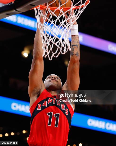 Bruce Brown of the Toronto Raptors dunks during the fourth quarter against the Atlanta Hawks at State Farm Arena on February 23, 2024 in Atlanta,...