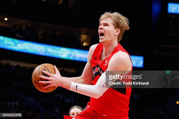 Gradey Dick of the Toronto Raptors drives to the basket during the third quarter against the Atlanta Hawks at State Farm Arena on February 23, 2024...
