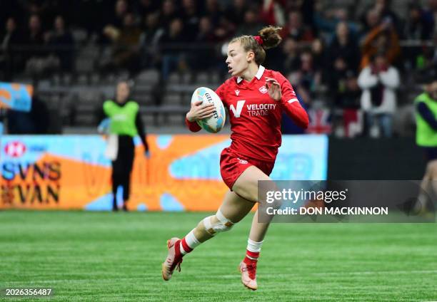 Canada's breaks away to score a try during the 2024 HSBC Canada Sevens rugby tournament match between Canada and Great Britain at BC Place Stadium in...