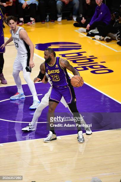 LeBron James of the Los Angeles Lakers handles the ball during the game on February 23, 2024 at Crypto.Com Arena in Los Angeles, California. NOTE TO...