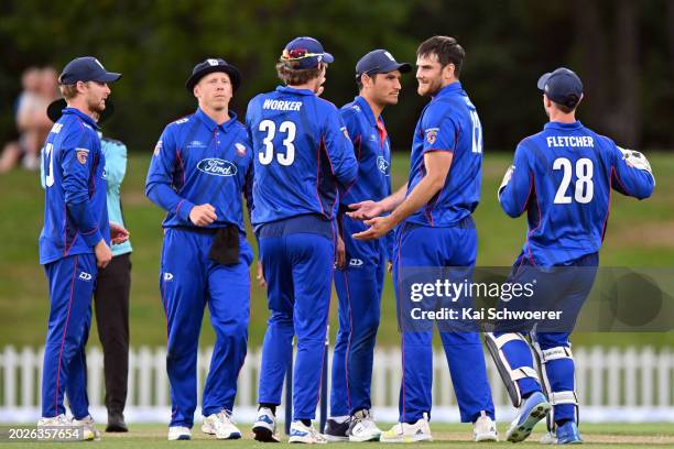 Ben Lister of Auckland is congratulated by team mates after dismissing Tom Latham of Canterbury during the Ford Trophy Grand Final match between...