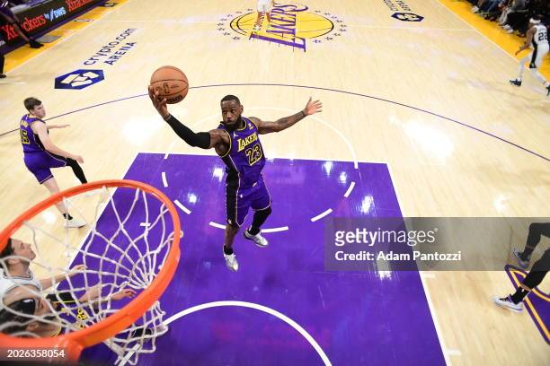 LeBron James of the Los Angeles Lakers grabs the rebound during the game on February 23, 2024 at Crypto.Com Arena in Los Angeles, California. NOTE TO...