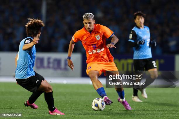 Cryzan of Shandong Taishan drives the ball during the AFC Champions League Round of 16 match between Kawasaki Frontale and Shandong Taishan on...