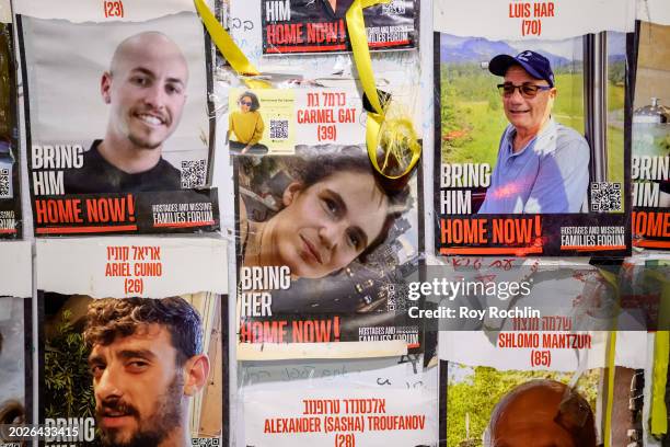 Posters of Hamas hostages Ariel Cunio, Alexander Troufanov, Carmel Gat, Shlomo Mantzur and Luis Har are posted on a wall at "Hostages Square" outside...