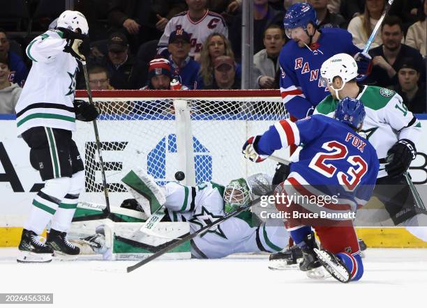 Adam Fox of the New York Rangers scores a goal at 7:46 of the first period against Scott Wedgewood of the Dallas Stars at Madison Square Garden on...