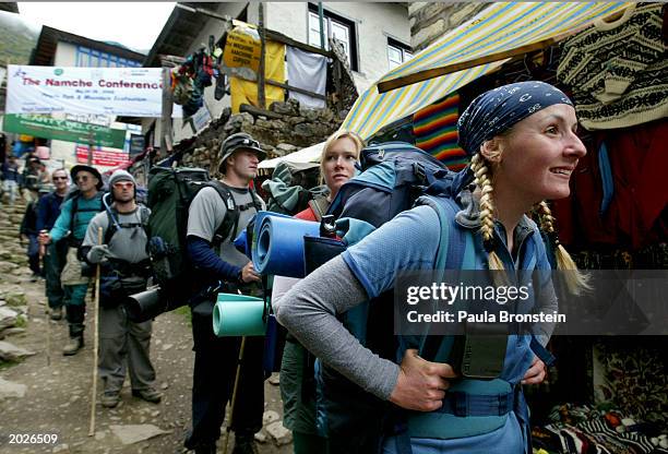 Holly Stehr from Sydney, Australia and her trekking group of 10 fellow Australians walk through the market area, on their way to Everest Base Camp,...