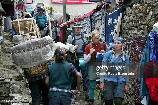 Holly Stehr from Sydney, Australia and her trekking group of 10 fellow Australians walk through the market area, on their way to Everest Base Camp,...