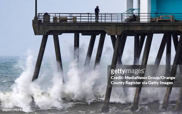 Huntington Beach, CA Waves break against the pilings of the Huntington Beach Pier in Huntington Beach as another storm brought rough surf, rain,...