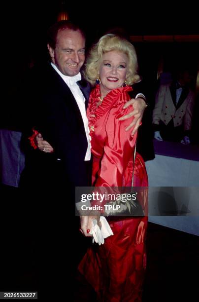 Australian musician Peter Allen and American actress Ginger Rogers pose for a portrait in New York, New York, circa 1982.