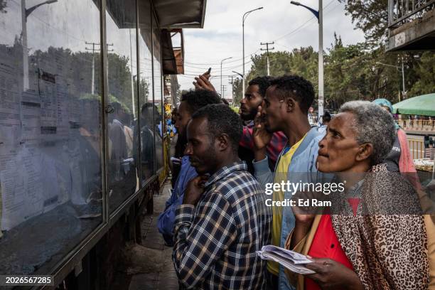 People look a notice board advertising job vacancies on February 14, 2024 in central Addis Ababa, Ethiopia. More than 20 million Ethiopians are in...