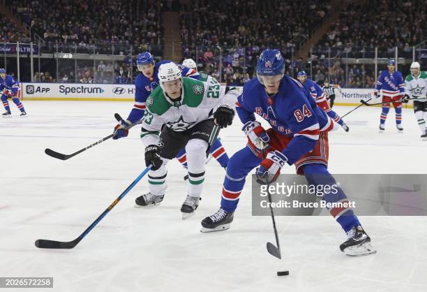 Adam Edstrom of the New York Rangers carries the puck against the Dallas Stars during the second period at Madison Square Garden on February 20, 2024...