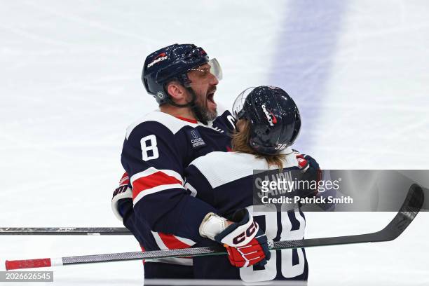 Alex Ovechkin of the Washington Capitals celebrates with teammates after scoring a goal against the New Jersey Devils during the third period at...