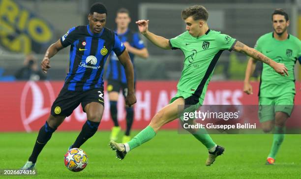 Pablo Barrios Rivas of Atlético Madrid and Danzal Dumfries of FC Internazionale in action during the UEFA Champions League 2023/24 round of 16 first...