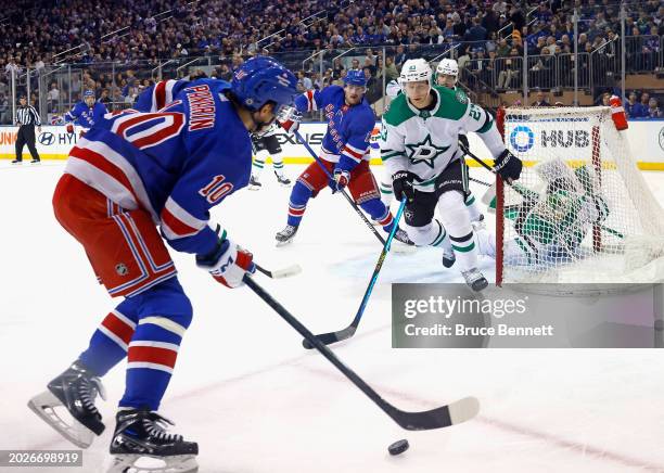 Esa Lindell of the Dallas Stars defends against Artemi Panarin of the New York Rangers at Madison Square Garden on February 20, 2024 in New York...