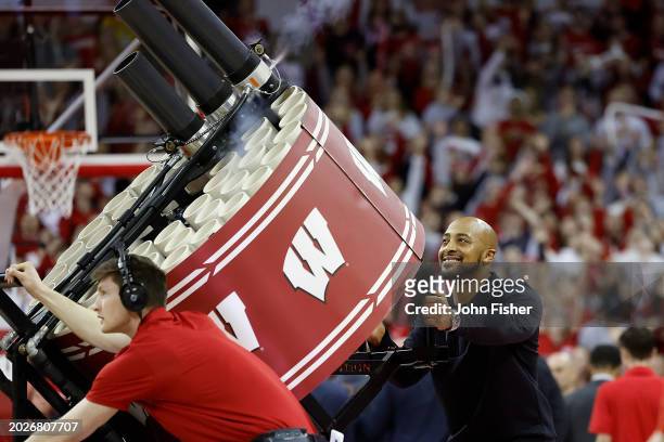 Dillion of the NFL Green Bay Packer shoots T-shirts into the stands during a timeout in the game between the Wisconsin Badgers and Maryland Terrapins...