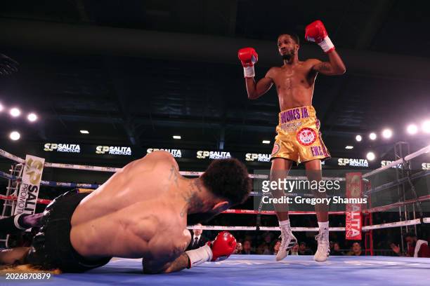 Ardreal Holmes Jr. Knocks down Marlon Harrington in the second round of their USBA super welterweight championship fight at the Wayne State Filed...