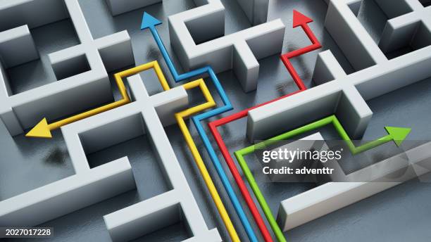 yellow, blue, red and green lines with arrows leading through different ways in a maze. choice concept - end to end solution stock pictures, royalty-free photos & images