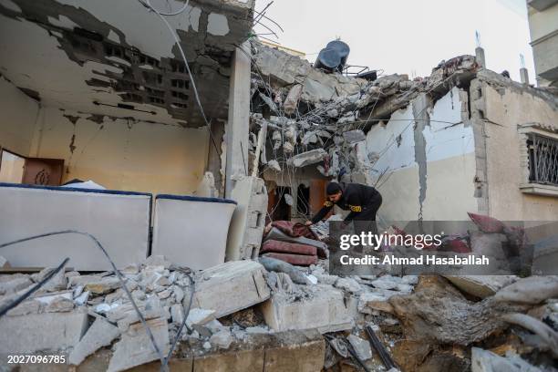 People inspect damage to their homes following Israeli air strikes on February 21, 2024 in Rafah, Gaza. Strikes have intensified as Israel reiterated...