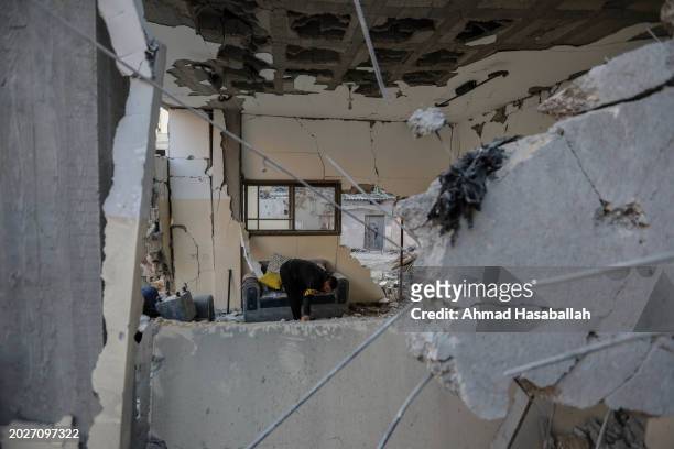 People inspect damage to their homes following Israeli air strikes on February 21, 2024 in Rafah, Gaza. Strikes have intensified as Israel reiterated...