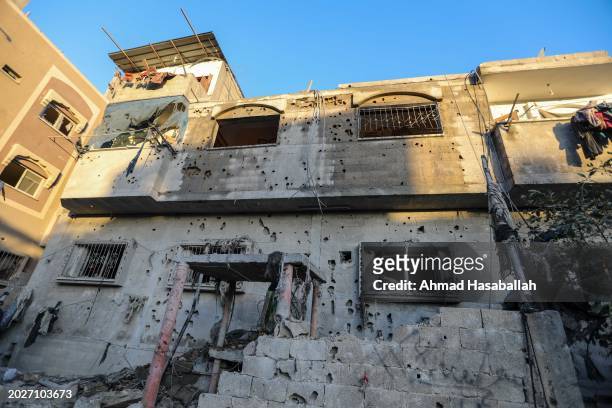 Debris is seen around a damaged building following Israeli air strikes on February 21, 2024 in Rafah, Gaza. Strikes have intensified as Israel...