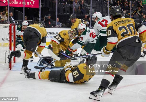 Marco Rossi of the Minnesota Wild scores a goal against Adin Hill of the Vegas Golden Knights in the third period of their game at T-Mobile Arena on...