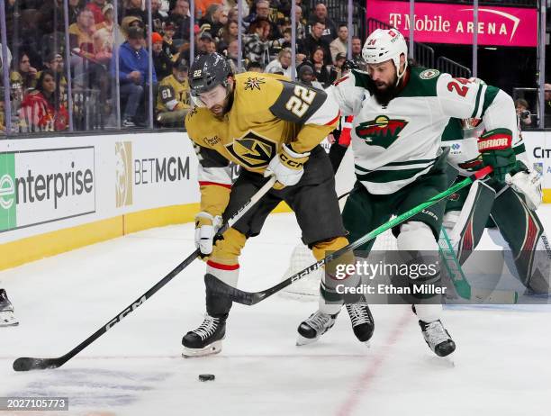 Michael Amadio of the Vegas Golden Knights skates with the puck against Zach Bogosian of the Minnesota Wild in the second period of their game at...