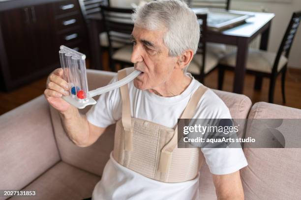 breathing exercises with spirometer at home - bronchitis stock pictures, royalty-free photos & images