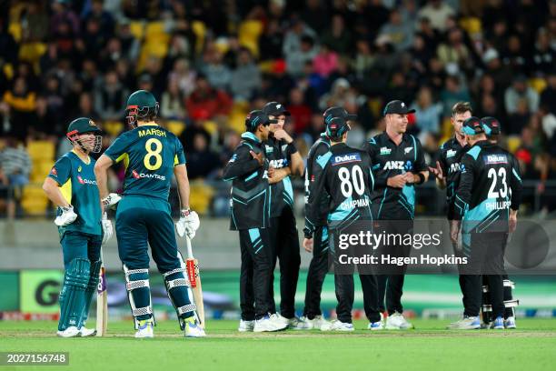 David Warner and Mitchell Marsh of Australia talk during a DRS decision during game one of the Men's T20 International series between New Zealand and...