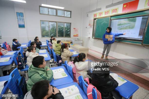Students attend a class as new semester begins on February 21, 2024 in Yangzhou, Jiangsu Province of China.