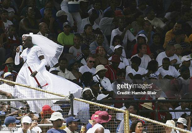 Fan wears a wedding dress in the crowd during the 4th One Day International between the West Indies and Australia on May 24, 2003 at Queens Park...
