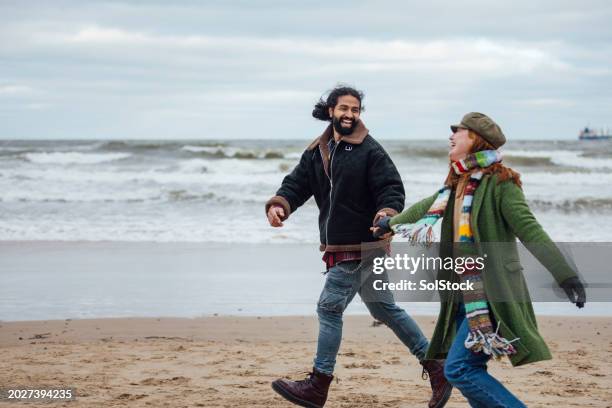 fun on the beach - multi coloured glove stock pictures, royalty-free photos & images