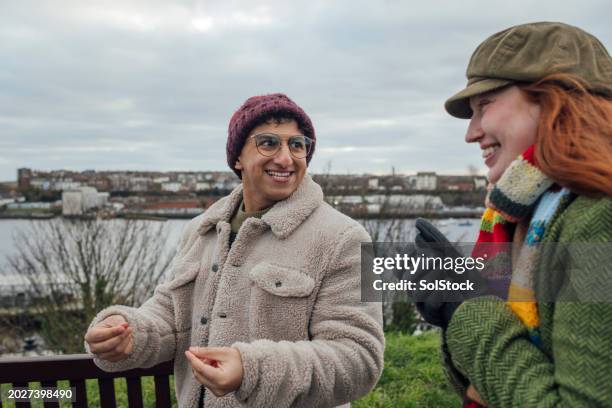 friends chatting and walking - multi coloured glove stock pictures, royalty-free photos & images