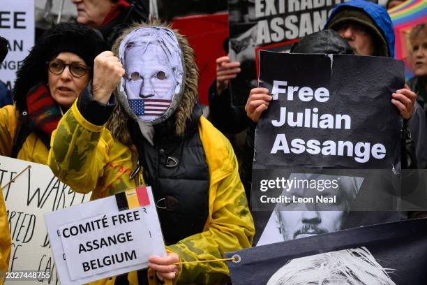 Supporters of Wikileaks founder Julian Assange chant and hold placards as they gather outside the High Court ahead of the second day of his US...