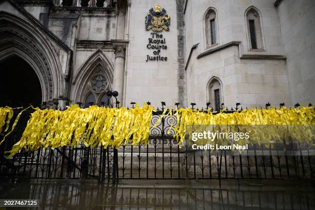 Yellow ribbons left by supporters of Wikileaks founder Julian Assange are seen on railings outside the High Court ahead of the second day of his US...