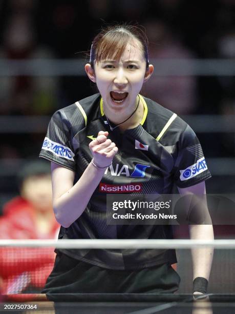 Japan's Hina Hayata reacts after winning a point against Chen Meng of China in the women's final at the world team table tennis championships in...