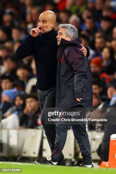 Manchester City manager Josep Guardiola makes a point to his assistant Juanma Lillo during the Premier League match between Manchester City and...