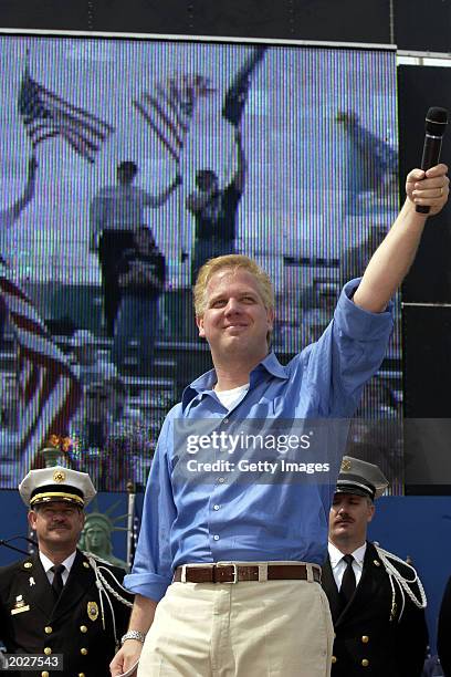 Radio talk show host Glenn Beck gestures to the crowd at the Rally for America event at Marshall University Stadium May 24, 2003 in Huntington, West...