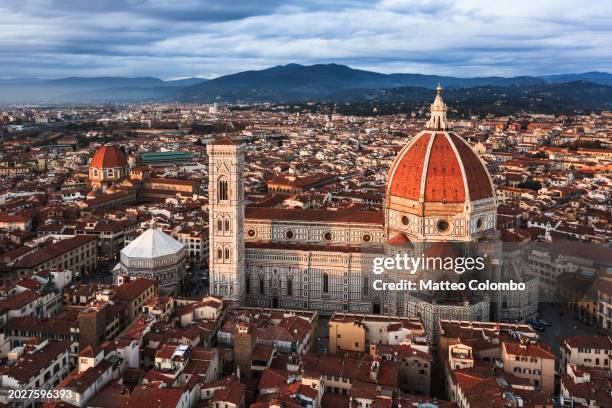 aerial view of cathedral at sunset, florence, italy - campanile foto e immagini stock