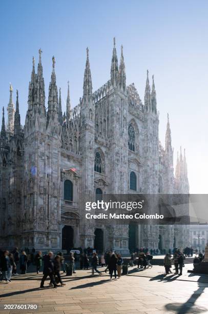 the duomo on a sunny day, milan, lombardy, italy - piazza del duomo milan stock pictures, royalty-free photos & images