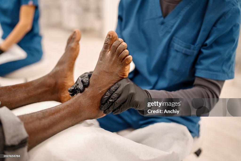 Close-up of a beautician doing pedicure