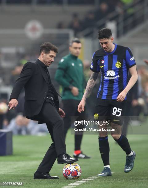 Atletico de Madrid head coach Diego Simeone controls the balls during the UEFA Champions League 2023/24 round of 16 first leg match between FC...