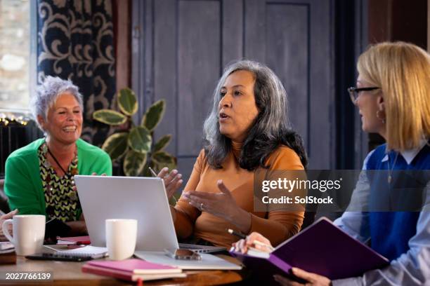 collaborative effort with work colleagues - 50 54 years stock pictures, royalty-free photos & images