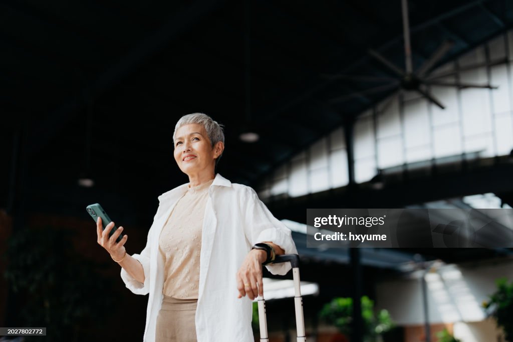 Asian senior woman business travel