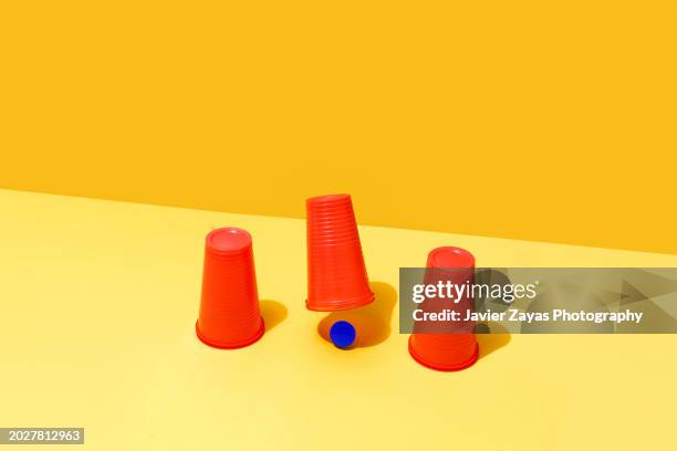 cups and ball guessing game (shell game) - guessing game stock pictures, royalty-free photos & images