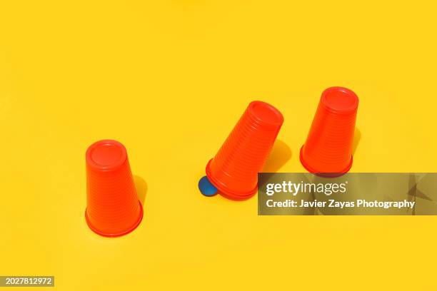 cups and ball guessing game (shell game) - guessing game stock pictures, royalty-free photos & images