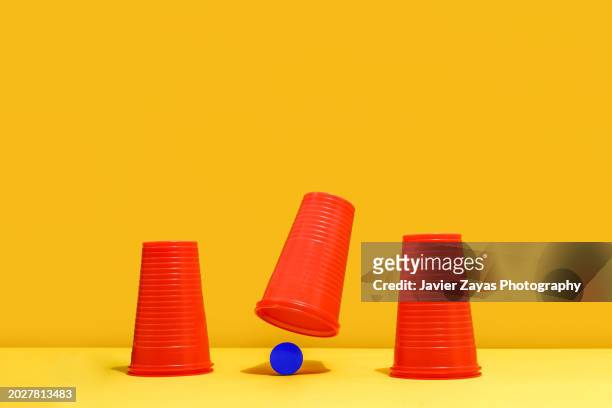 cups and ball guessing game (shell game) - guessing game stock pictures, royalty-free photos & images