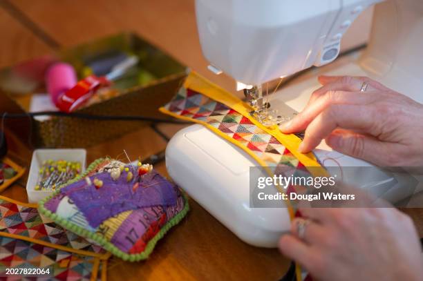 working with textiles - sewing machine stock pictures, royalty-free photos & images